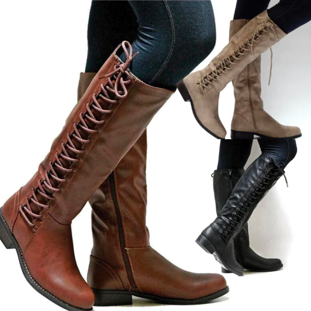 Lace-up knee-high boots in black, worn with skinny jeans