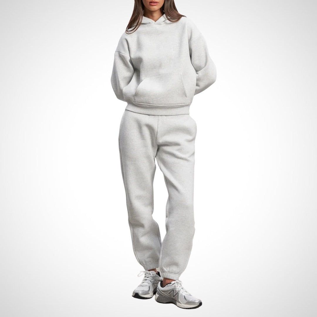 Two-piece hoodie and jogger set in grey, worn on a model