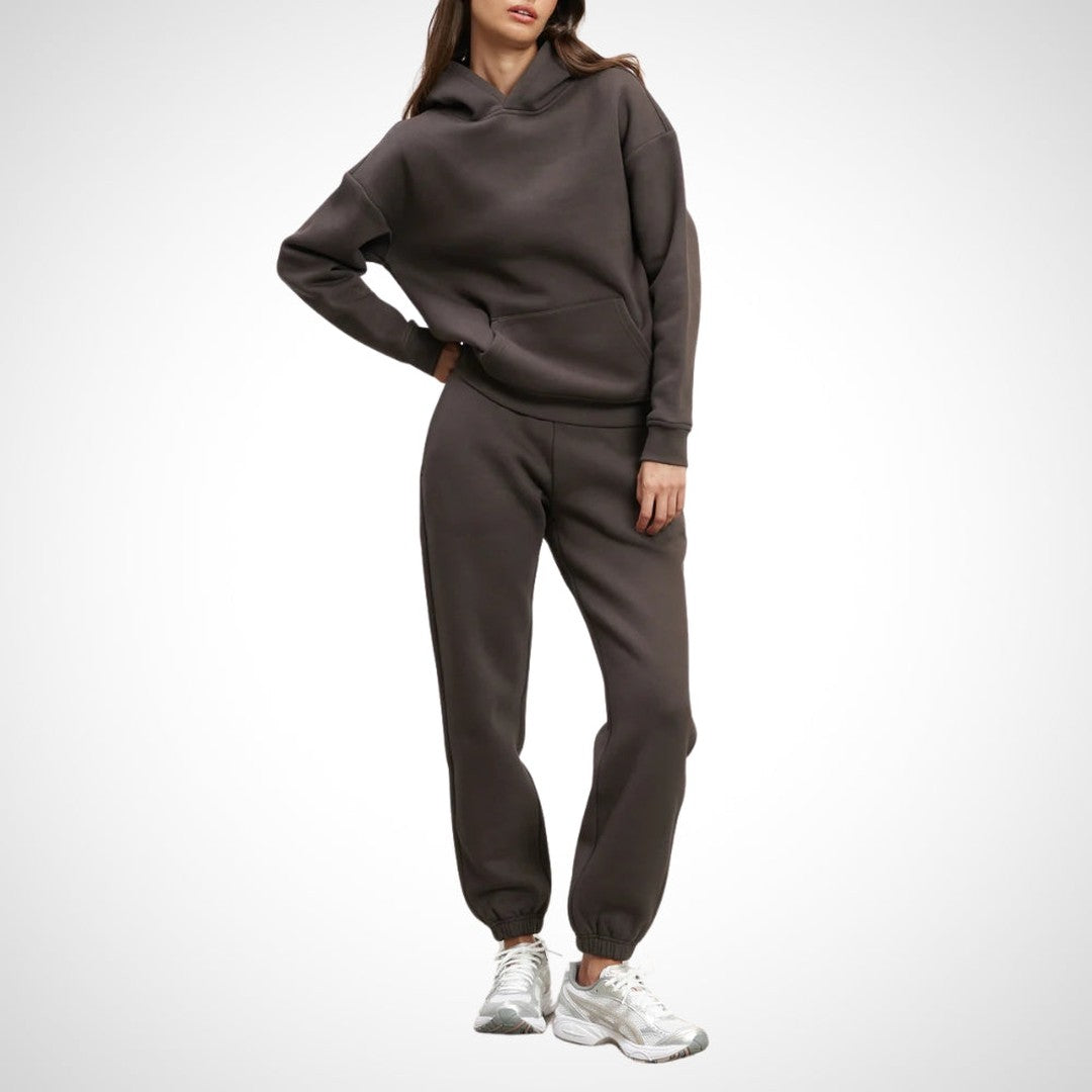 Two-piece hoodie and jogger set in brown, worn on a model