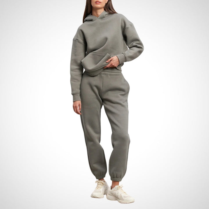 Two-piece hoodie and jogger set in olive, worn on a model